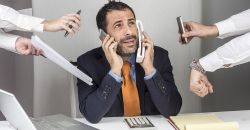 Man overwhelmed by communications